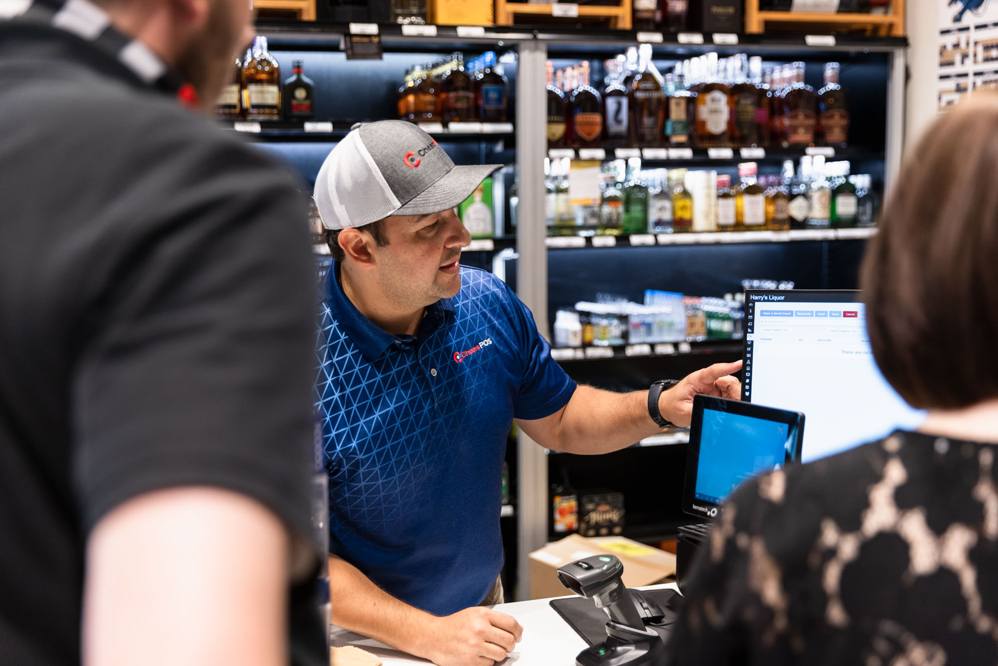 A man greets his customers, who came because of quality liquor store marketing