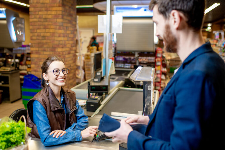 Cashier Smiling at Customer