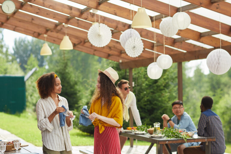 Friends Preparing for a Party Outdoors