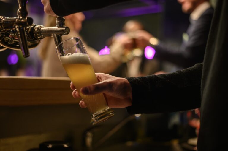 Bartender filling a beer at a brewery